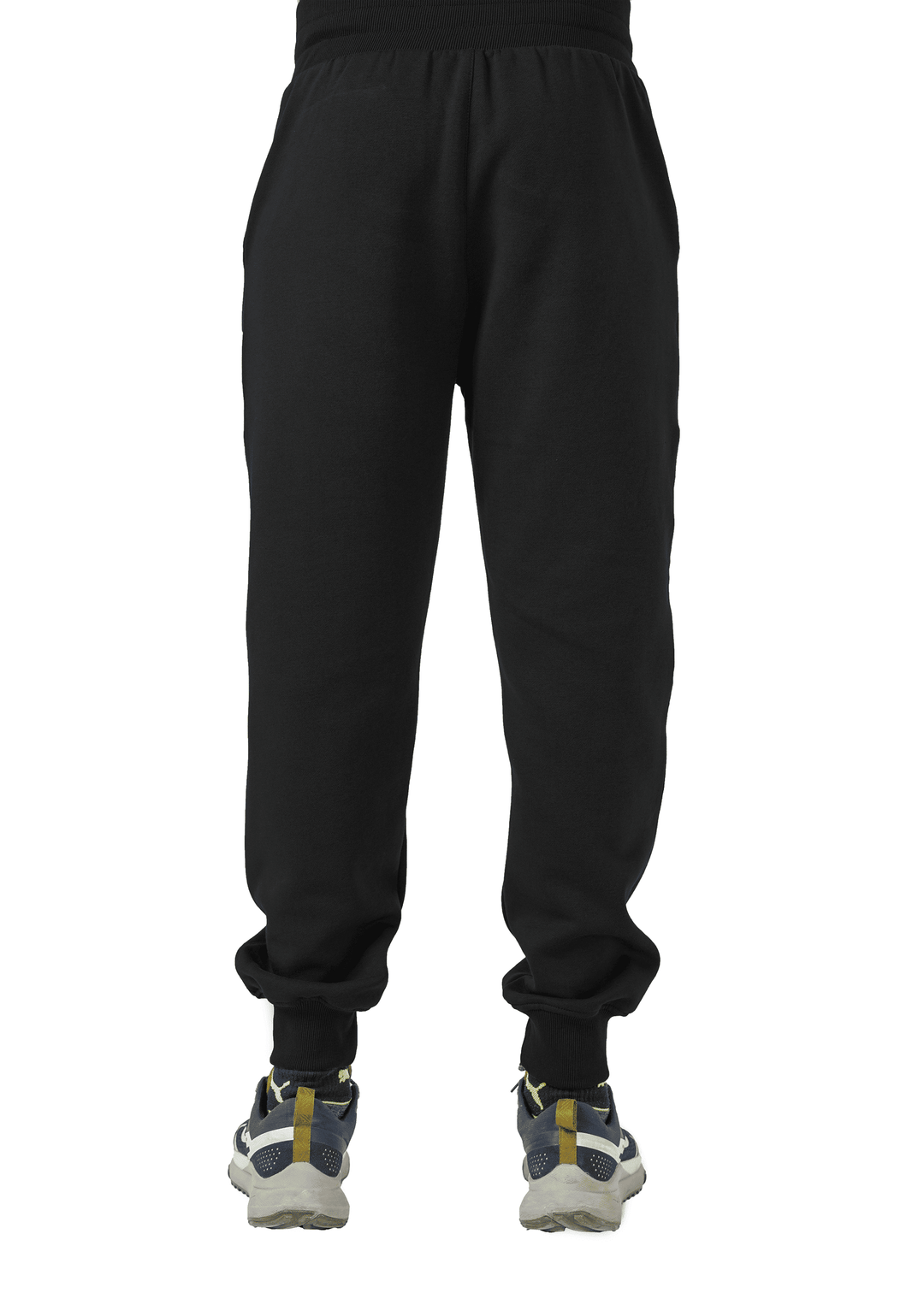 Black sweatpants worn by a person on a white background