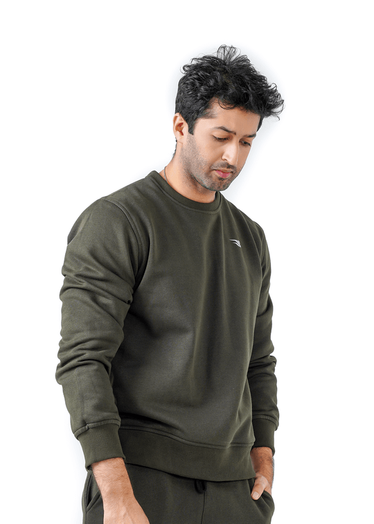 Man wearing an olive green sweatshirt on a white background