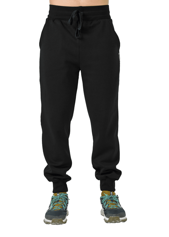 Black sweatpants worn by a person on a white background