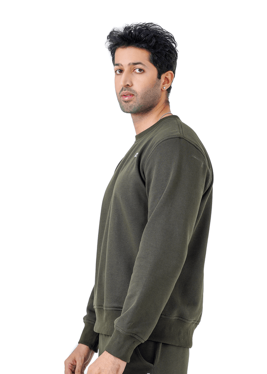 Man wearing an olive green sweatshirt on a white background
