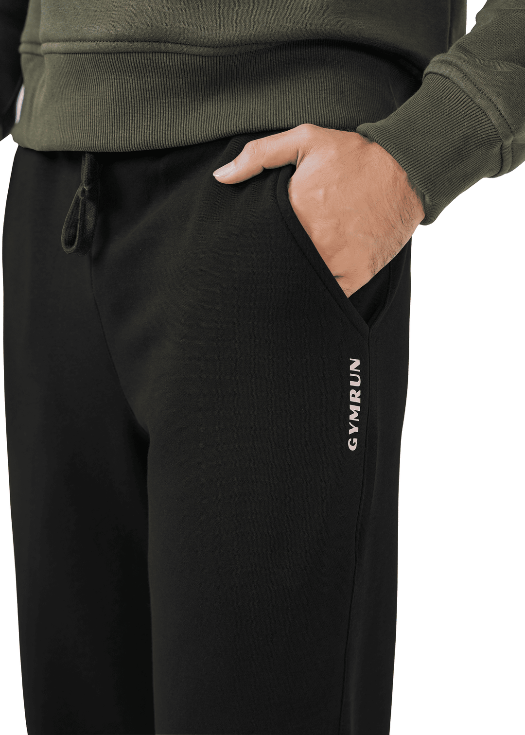 Black jogger pants with 'Gymrun' logo worn by a person, against a neutral background.