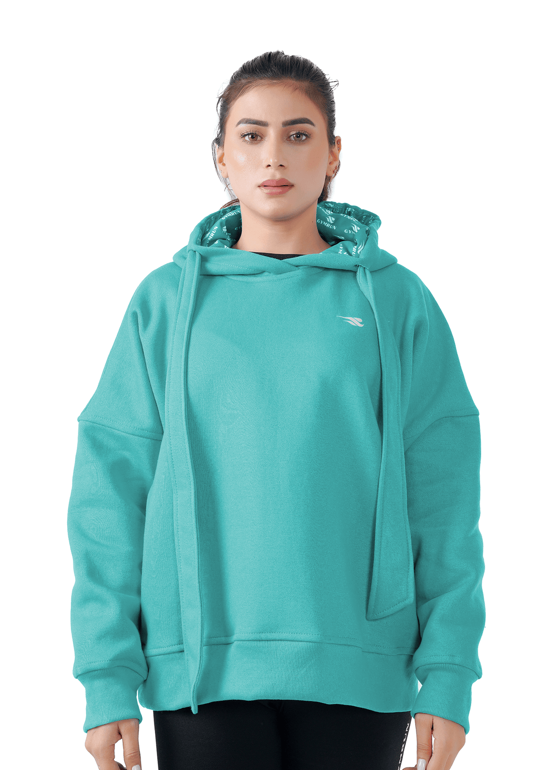 Woman wearing a teal hoodie on a white background