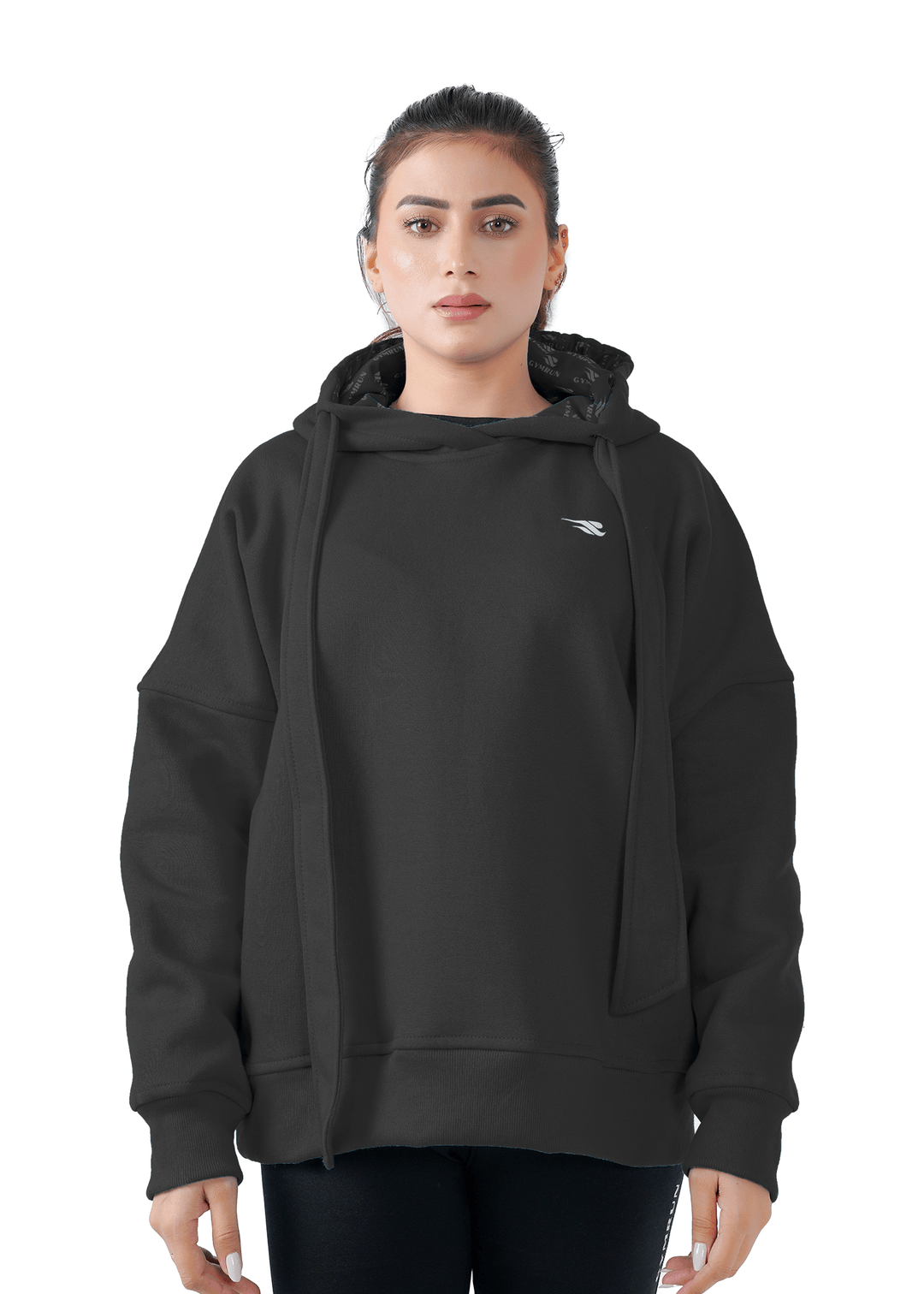 Woman wearing a black hoodie with a brand logo on a white background