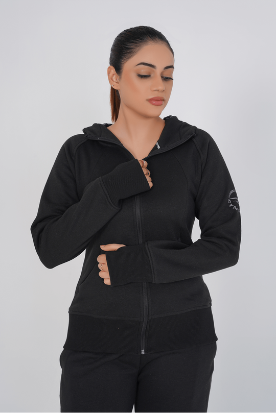 Woman wearing a black hoodie on a white background